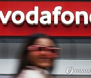 BRITAIN VODAFONE THREE MERGER