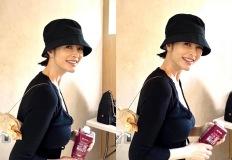 김혜수, 얼굴 작아보이는 비결! 푹 눌러쓴 버킷햇 시크한 블랙 카디건 조합 이미지