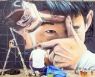 영국 런던의 벽화에 나타난 '찰칵'하는 손흥민