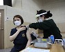 Military health care workers get first vaccine shots  