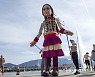 SWITZERLAND GIANT PUPPET AMAL REFUGEE