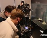 금동삼존불감에 대한 뜨거운 취재 열기